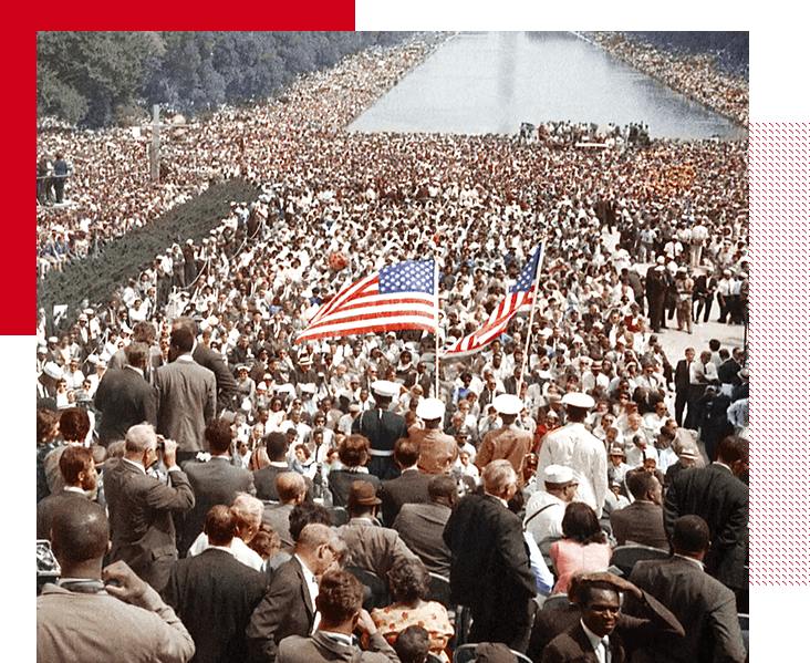 People in crowd catching U.S. Flag